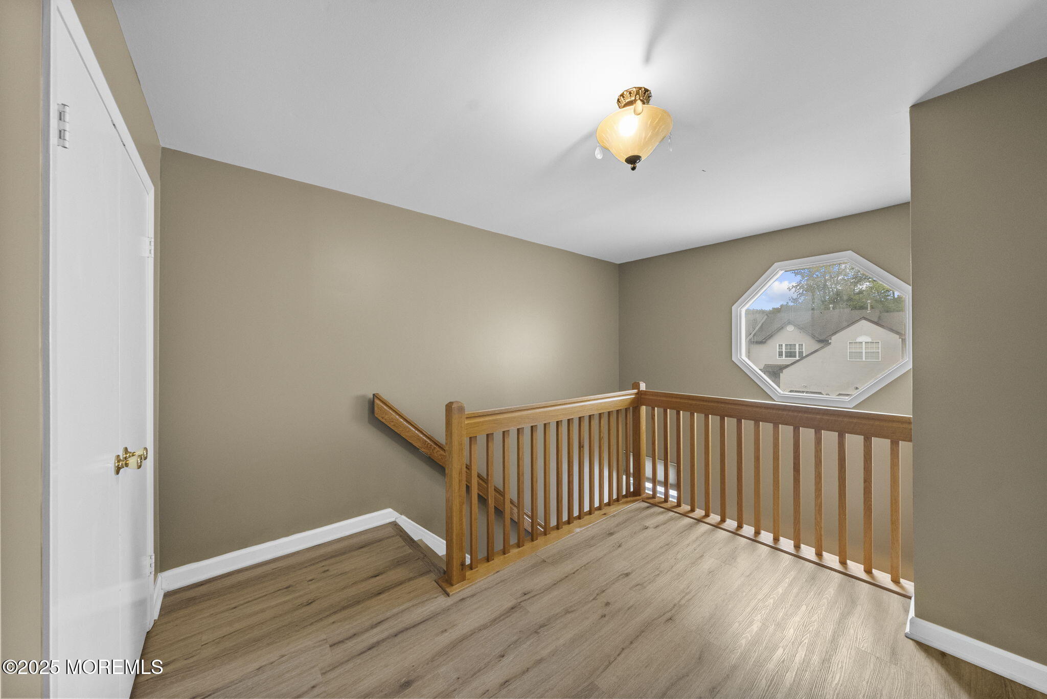 63 Atrium Way, Unit 63 Manalapan, NJ 07726 - Photo 18 of 40 a view of staircase with wooden floor