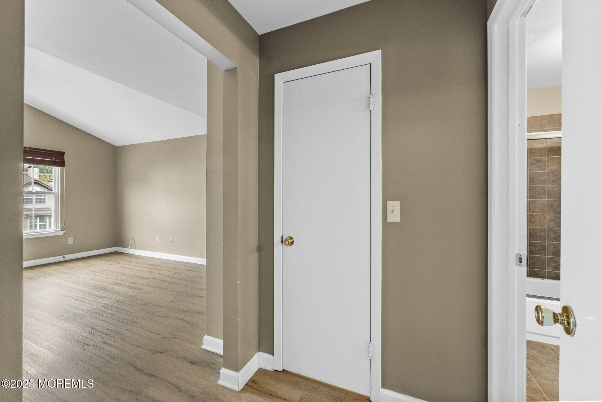 63 Atrium Way, Unit 63 Manalapan, NJ 07726 - Photo 23 of 40 a view of livingroom with hardwood floor and window