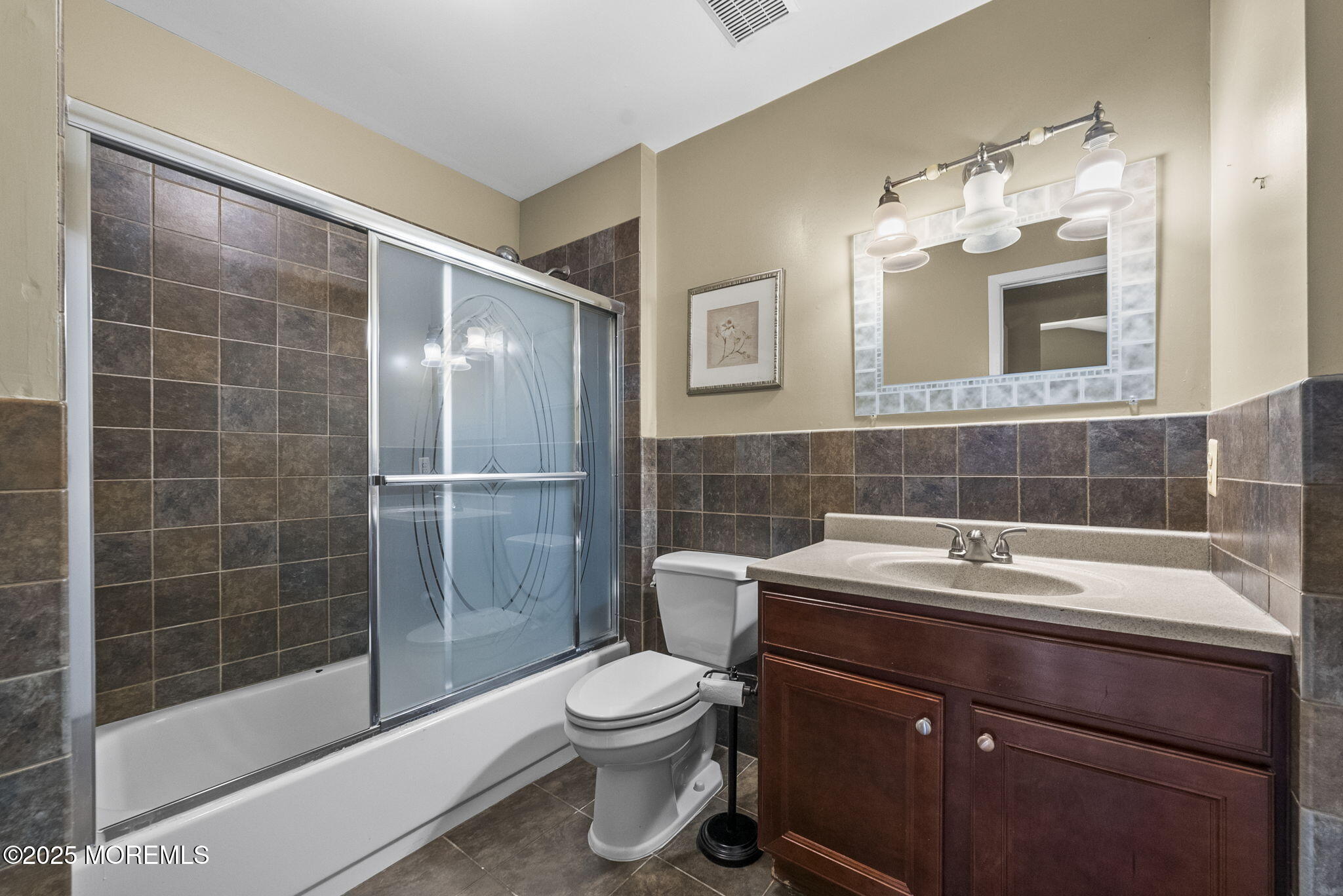63 Atrium Way, Unit 63 Manalapan, NJ 07726 - Photo 25 of 40 a bathroom with a sink toilet and shower