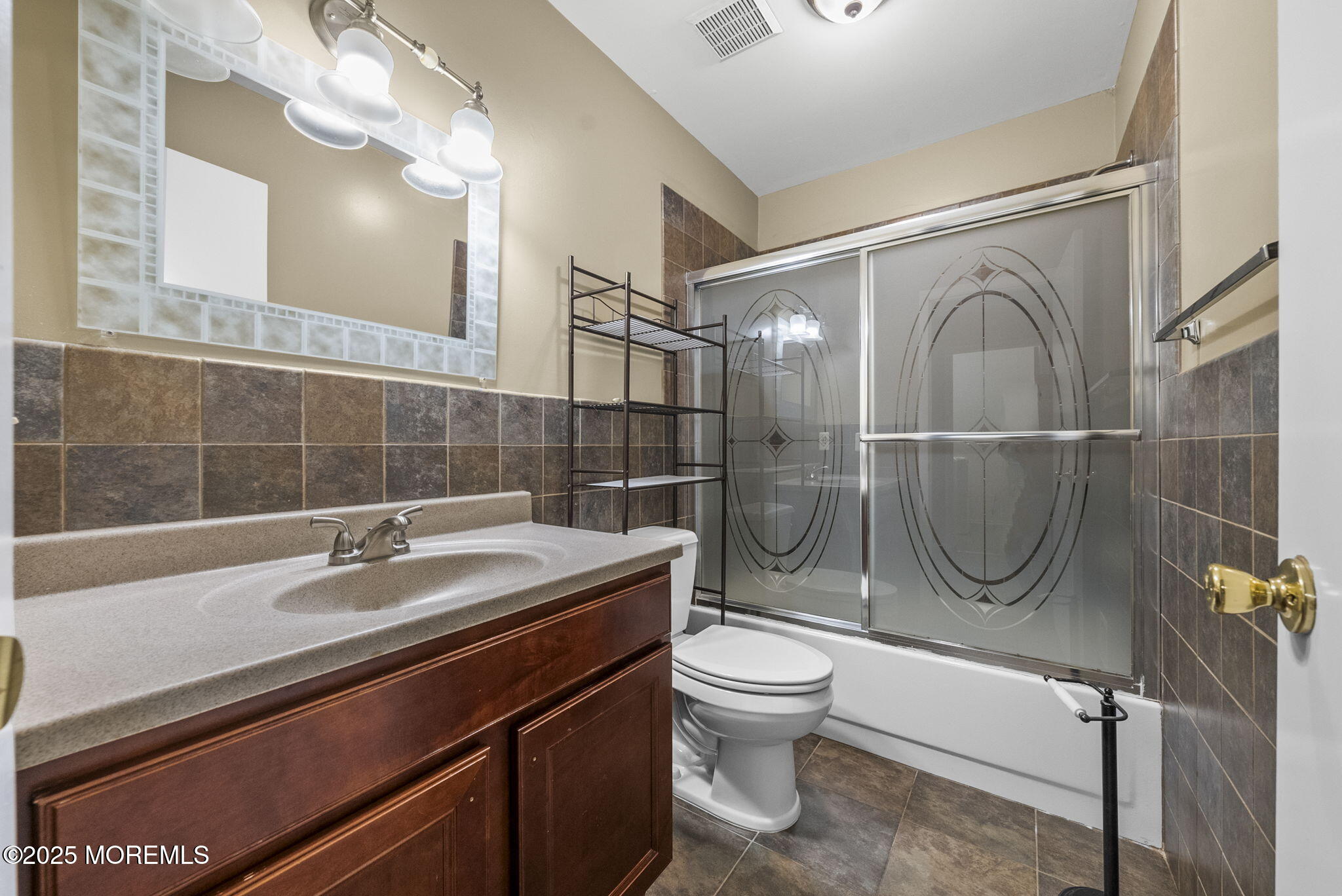 63 Atrium Way, Unit 63 Manalapan, NJ 07726 - Photo 26 of 40 a bathroom with a sink a toilet and a shower