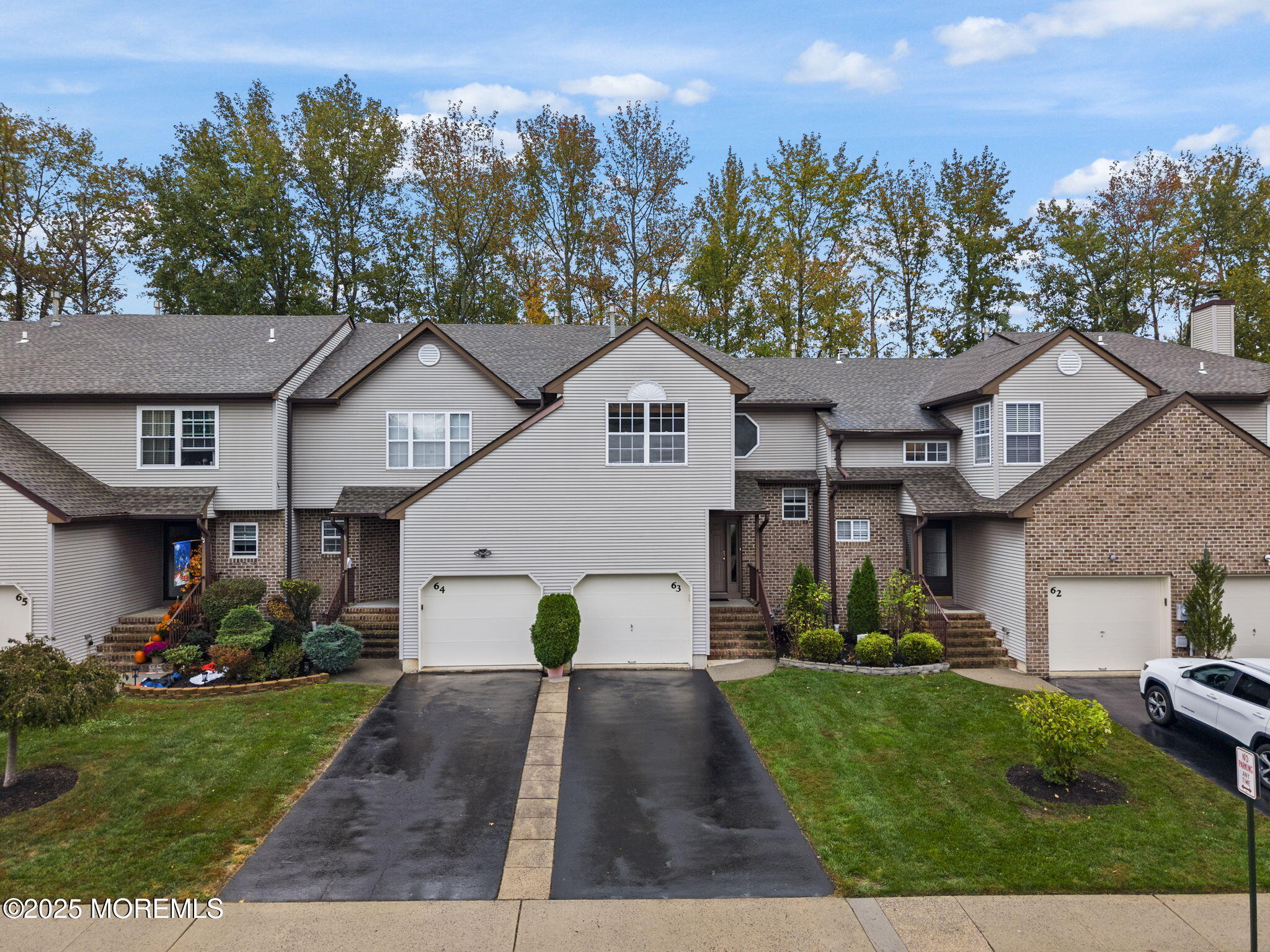 63 Atrium Way, Unit 63 Manalapan, NJ 07726 - Photo 3 of 40 a view of a yard in front of house