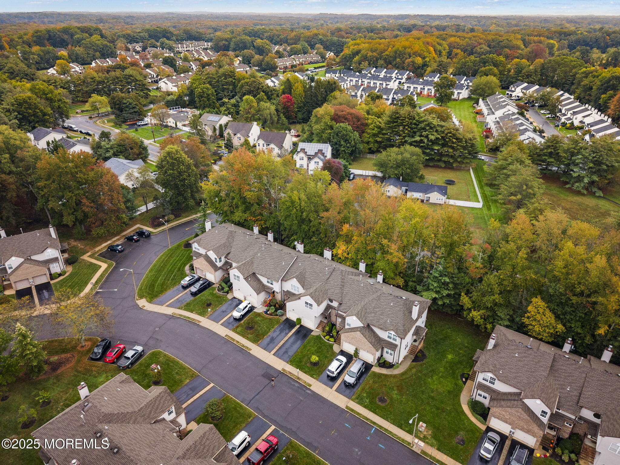 63 Atrium Way, Unit 63 Manalapan, NJ 07726 - Photo 38 of 40 an aerial view of residential houses with outdoor space