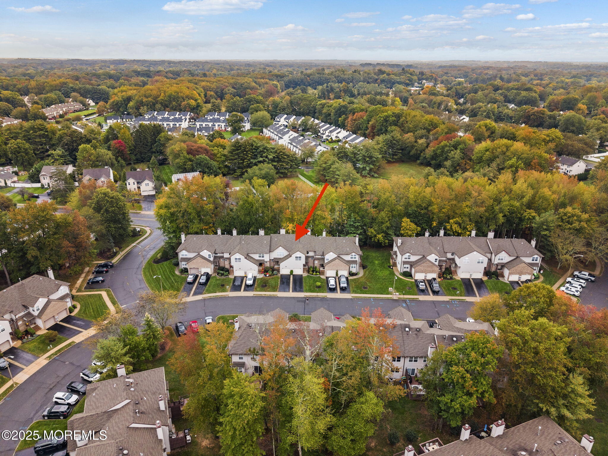 63 Atrium Way, Unit 63 Manalapan, NJ 07726 - Photo 39 of 40 an aerial view of a city with lots of residential buildings