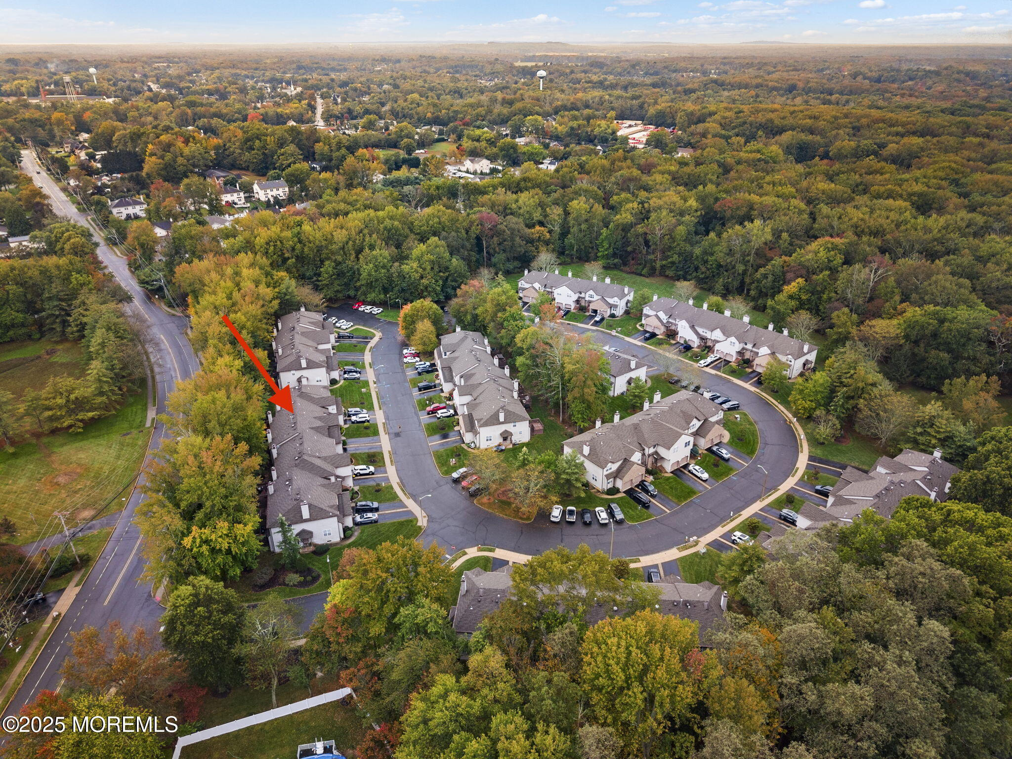 63 Atrium Way, Unit 63 Manalapan, NJ 07726 - Photo 40 of 40 an aerial view of a house with a lake view