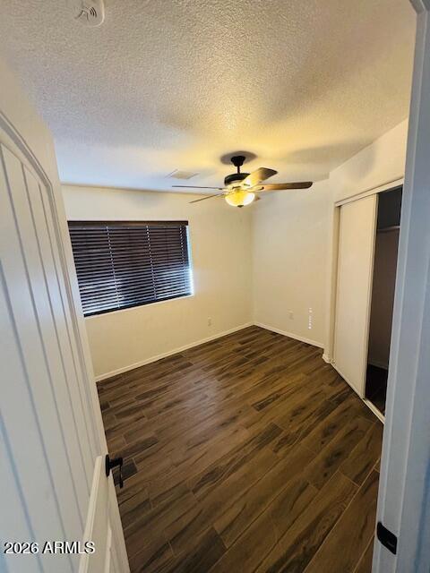 1130 East 4th Street Douglas, AZ 85607 - Photo 12 of 19 a view of empty room with a fireplace and wooden floor