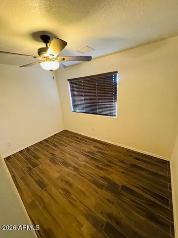 a bathroom with a sink mirror and toilet