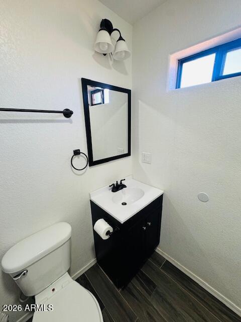 1130 East 4th Street Douglas, AZ 85607 - Photo 15 of 19 a bathroom with a sink mirror and toilet
