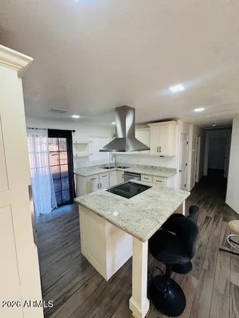 a kitchen with a stove a sink and a refrigerator