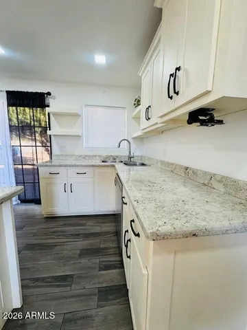 a kitchen with a stove and a sink