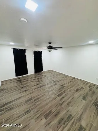a view of a room with a wooden floor