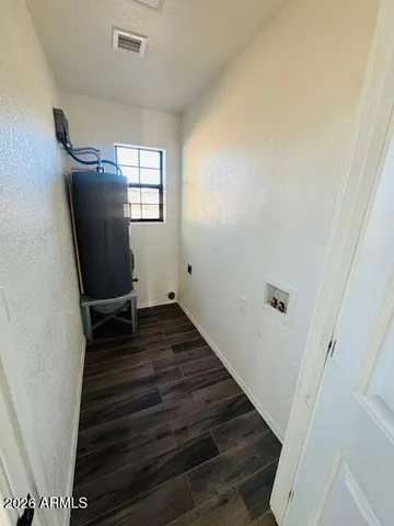 a bathroom with a sink mirror and toilet