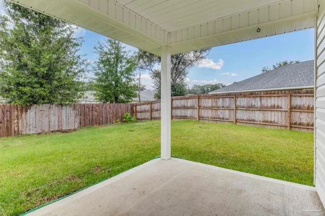 a front view of house with yard and outdoor seating