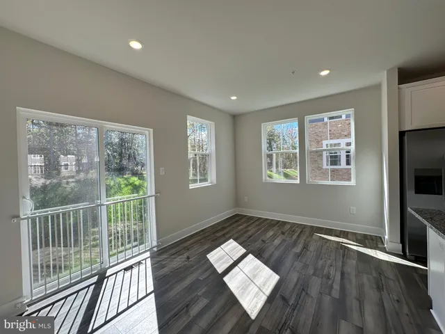 a view of empty room with a fireplace