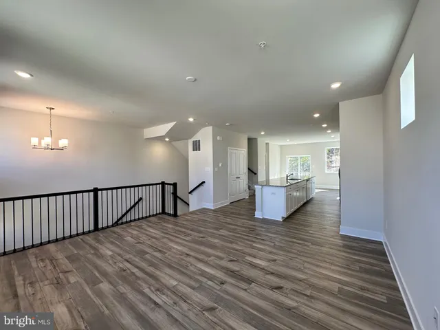 a view of kitchen with furniture and wooden floor