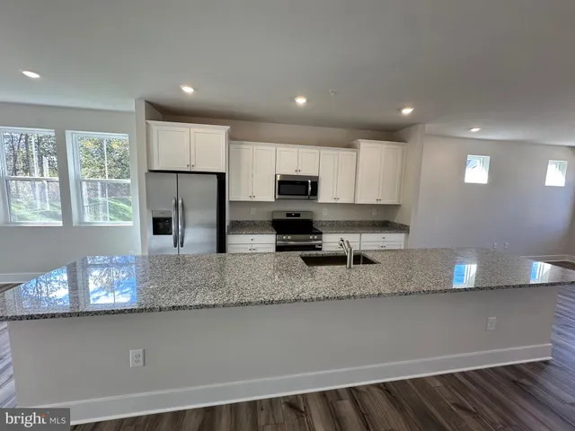 a view of empty room with windows