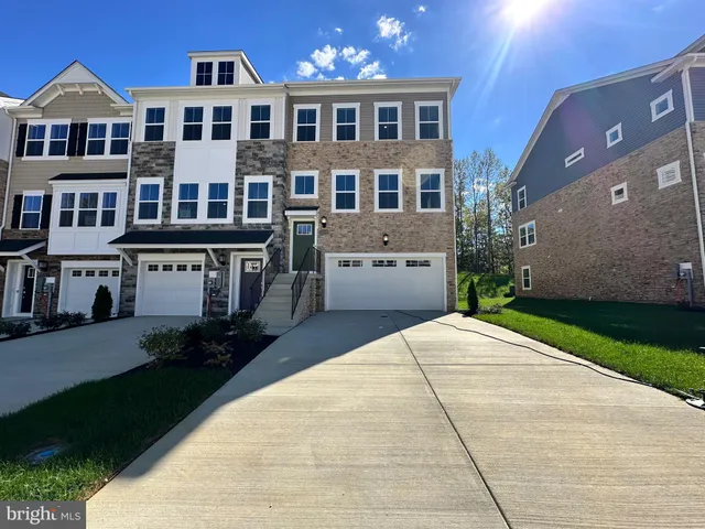 a view of multiple houses with a yard