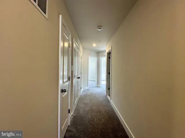 a view of an empty room with windows