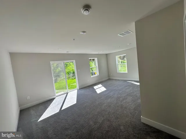 a front view of a building with a garage