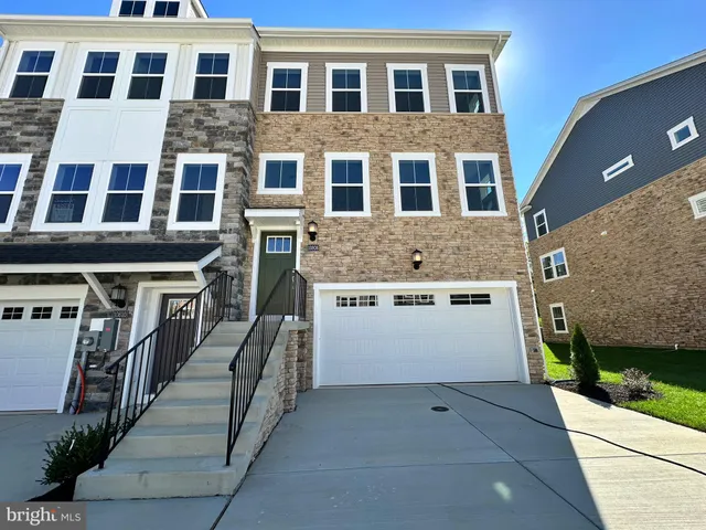 a front view of a building with a yard