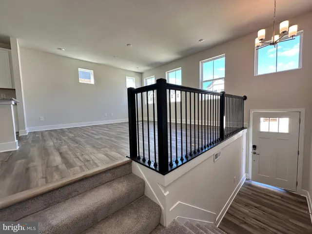 a view of kitchen and dining room with wooden floor