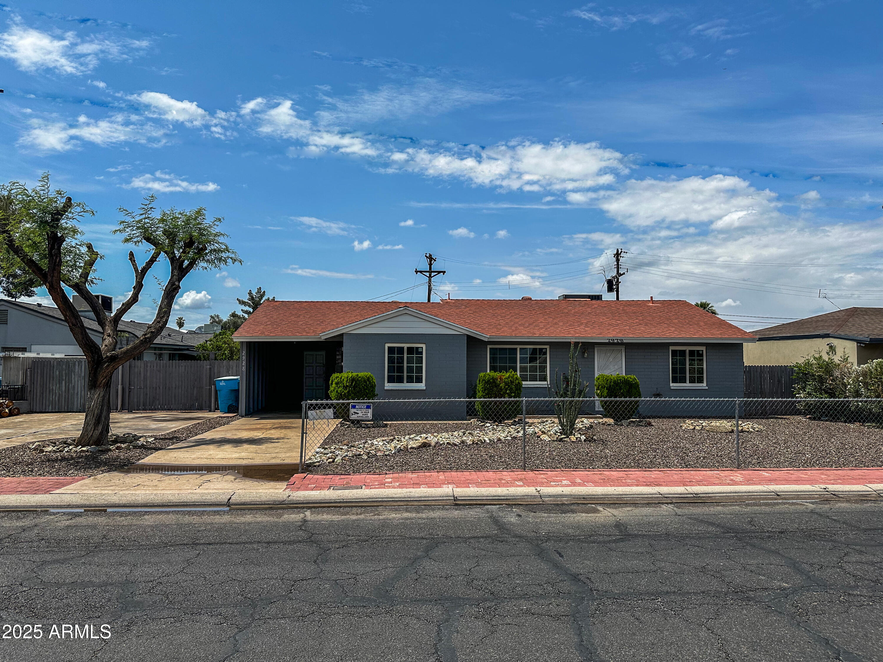 2928 North 37th Avenue Phoenix, AZ 85019 - Photo 1 of 13 a view of the house with basketball court