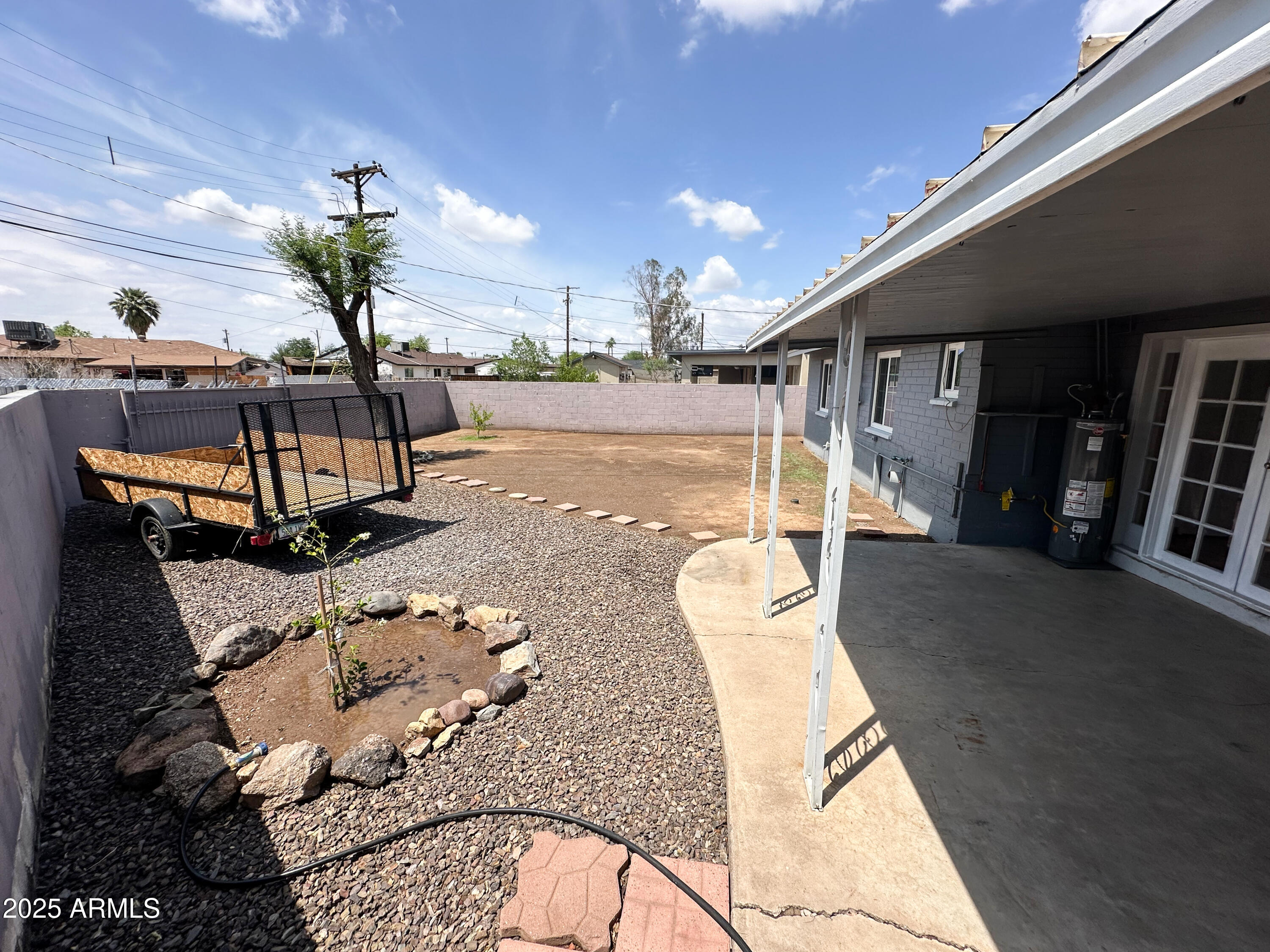 2928 North 37th Avenue Phoenix, AZ 85019 - Photo 12 of 13 a view of a living room and kitchen