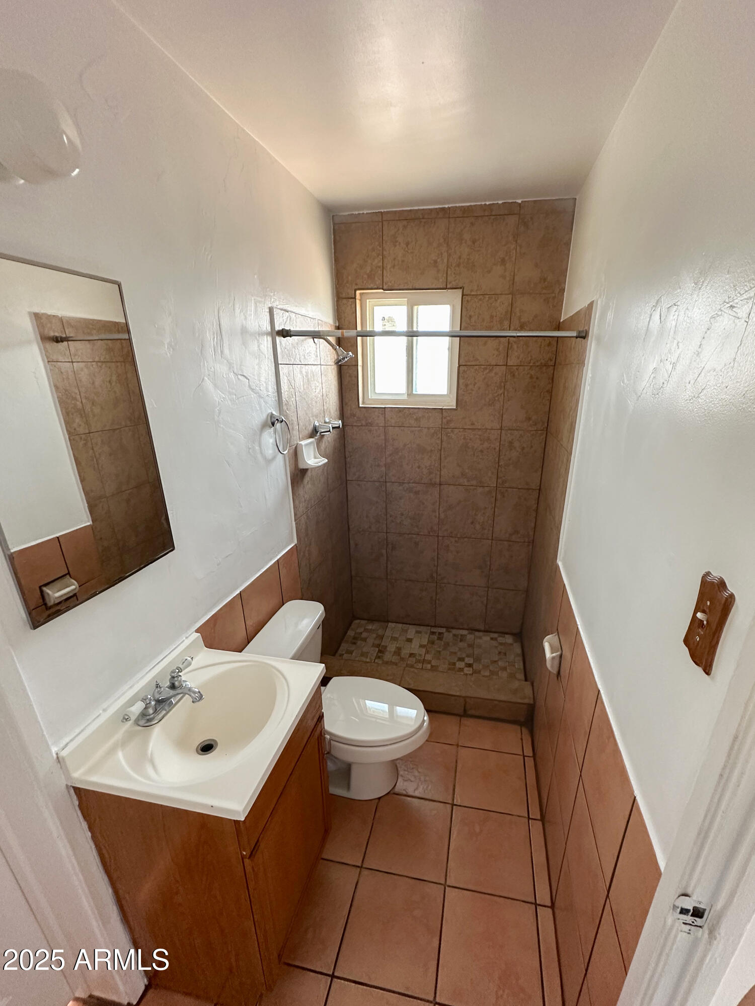 2928 North 37th Avenue Phoenix, AZ 85019 - Photo 5 of 13 a bathroom with a sink toilet and shower