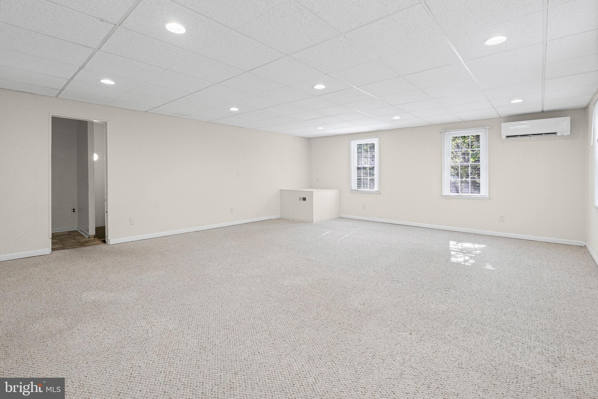 6 Cinder Road Lutherville-Timonium, MD 21093 - Photo 11 of 41 an empty room with a empty space and windows