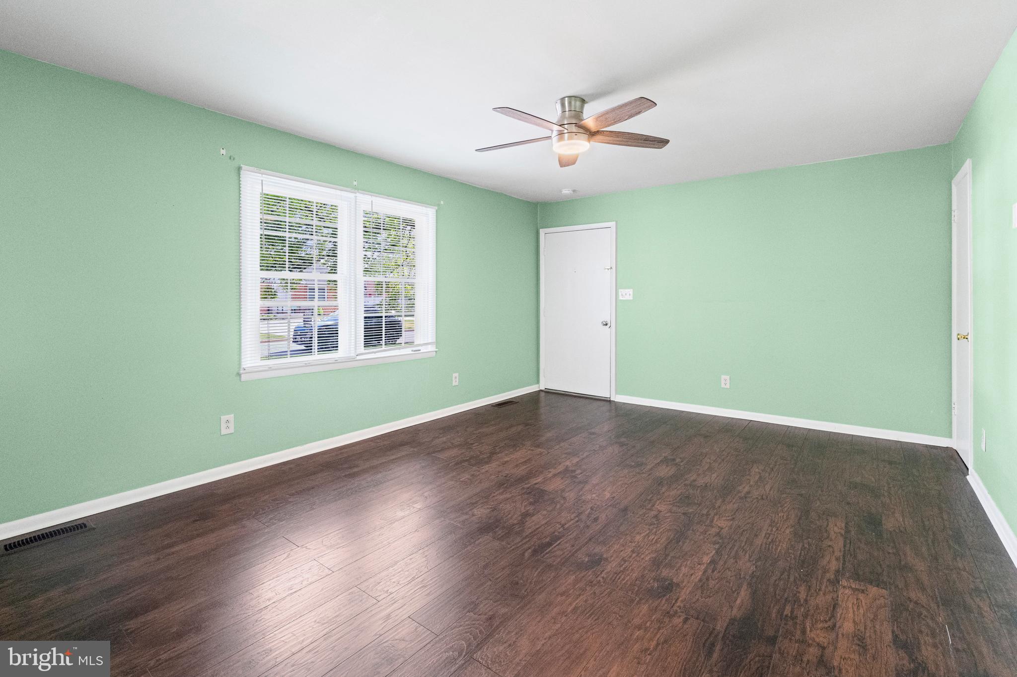 6 Cinder Road Lutherville-Timonium, MD 21093 - Photo 13 of 41 a view of empty room with wooden floor and fan