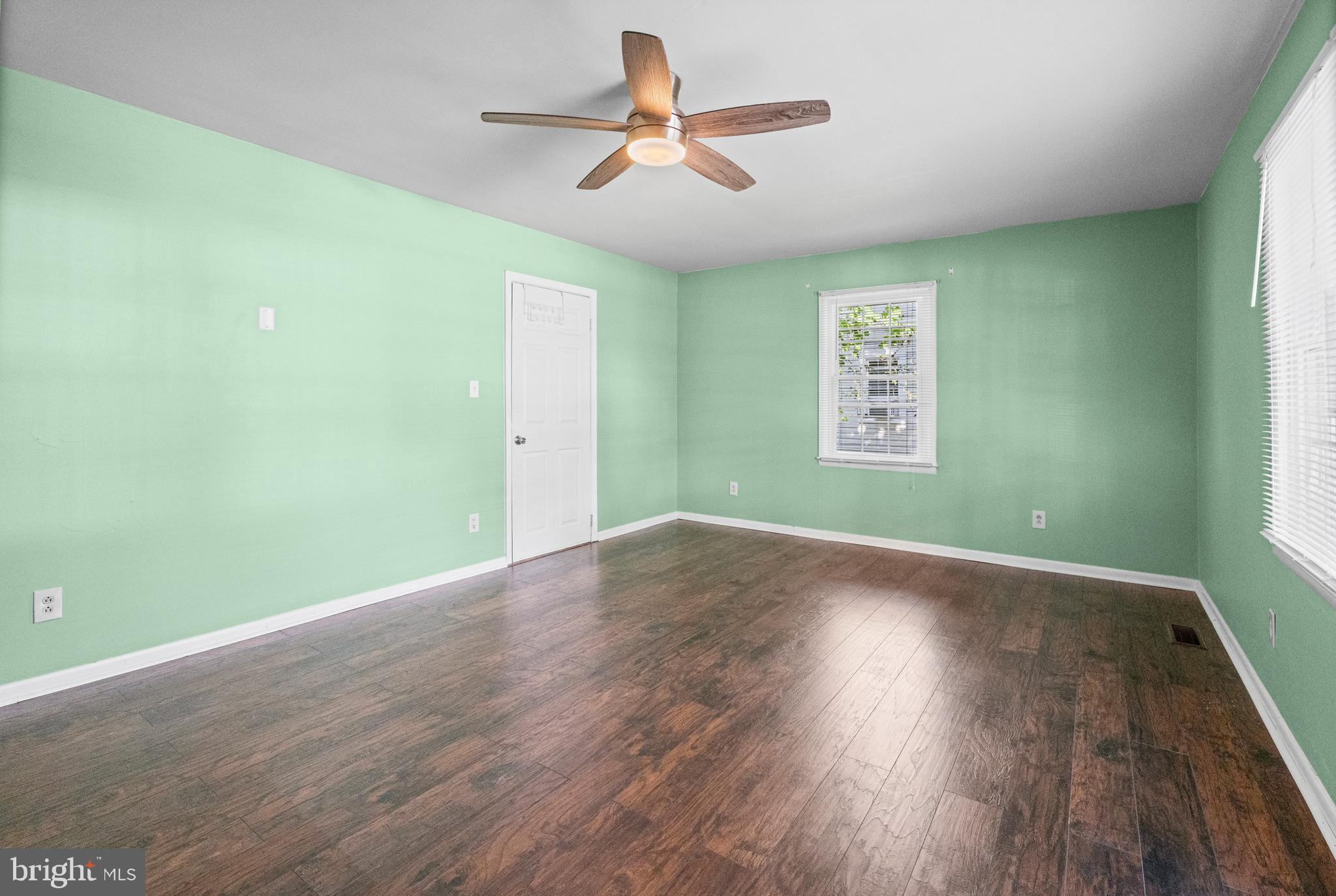 6 Cinder Road Lutherville-Timonium, MD 21093 - Photo 14 of 41 an empty room with wooden floor and windows