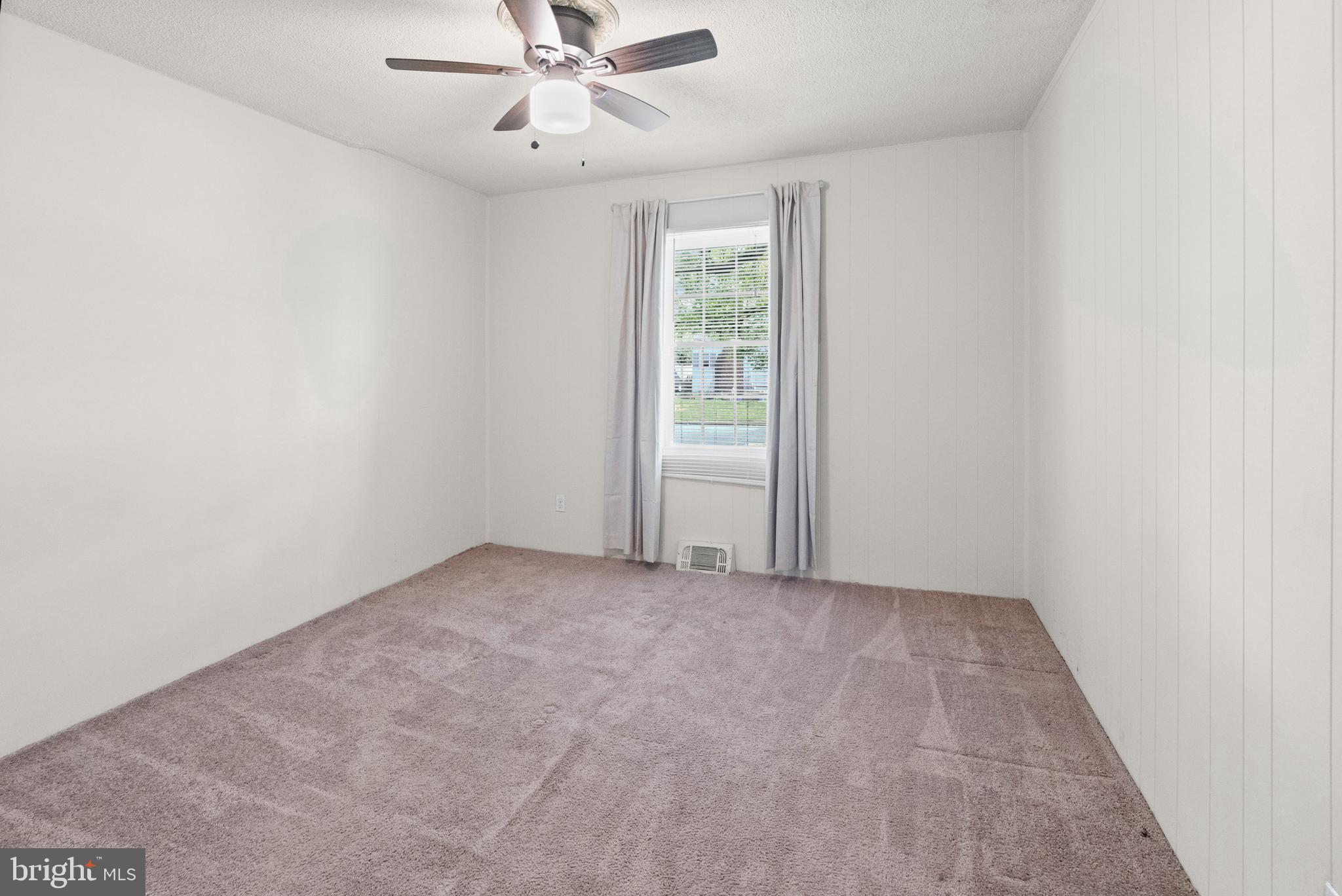 6 Cinder Road Lutherville-Timonium, MD 21093 - Photo 17 of 41 an empty room with windows and fan
