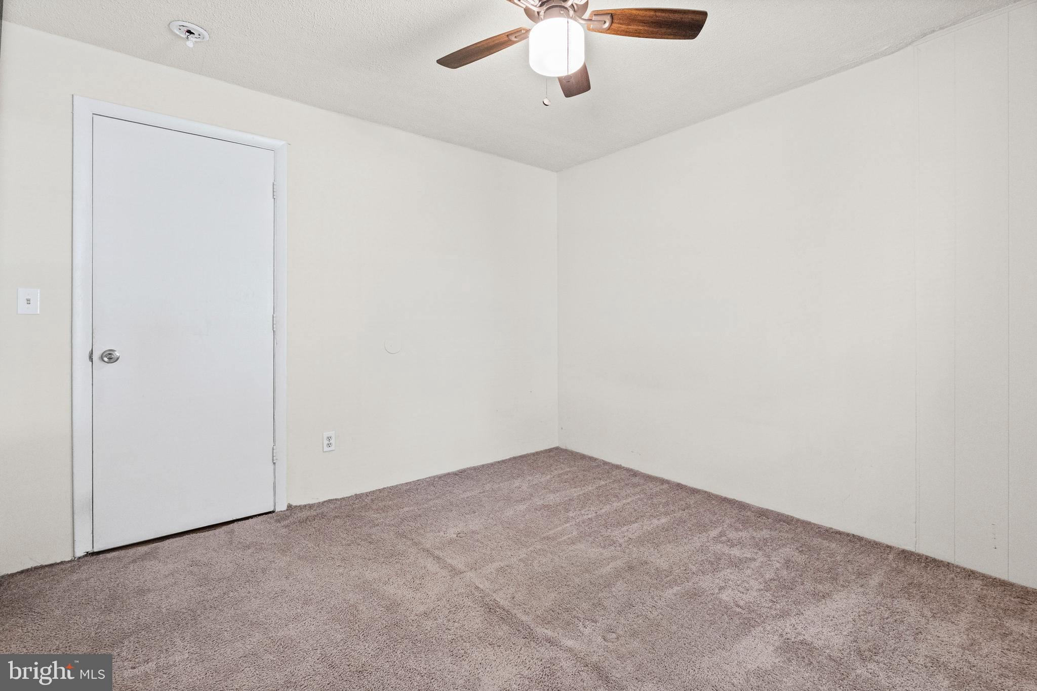 6 Cinder Road Lutherville-Timonium, MD 21093 - Photo 18 of 41 an empty room with a chandelier fan