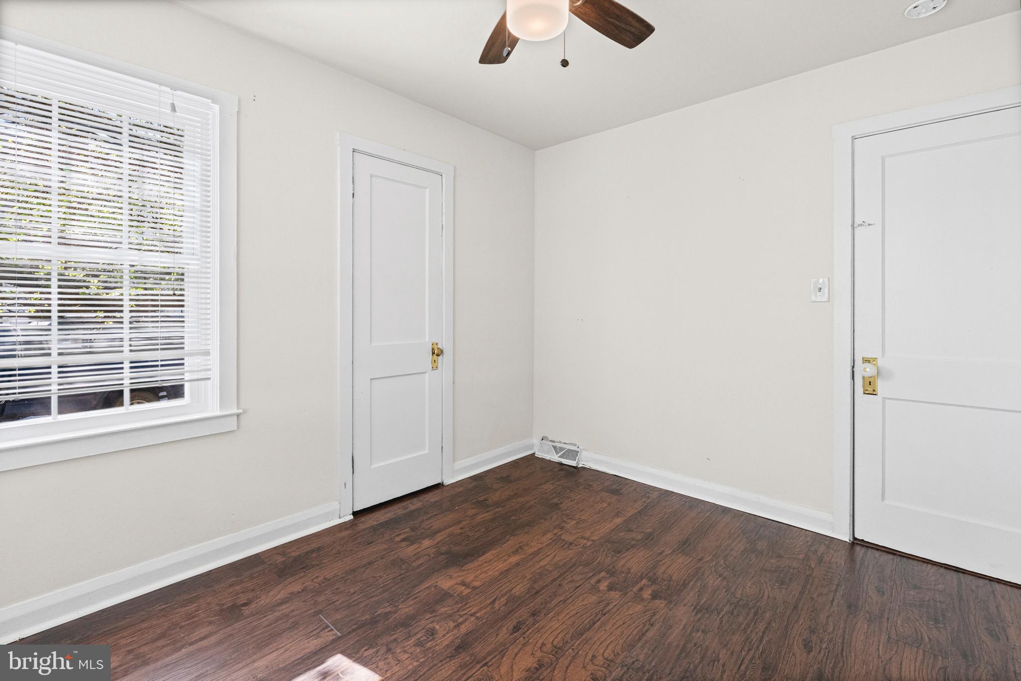 6 Cinder Road Lutherville-Timonium, MD 21093 - Photo 21 of 41 an empty room with wooden floor cabinet and windows