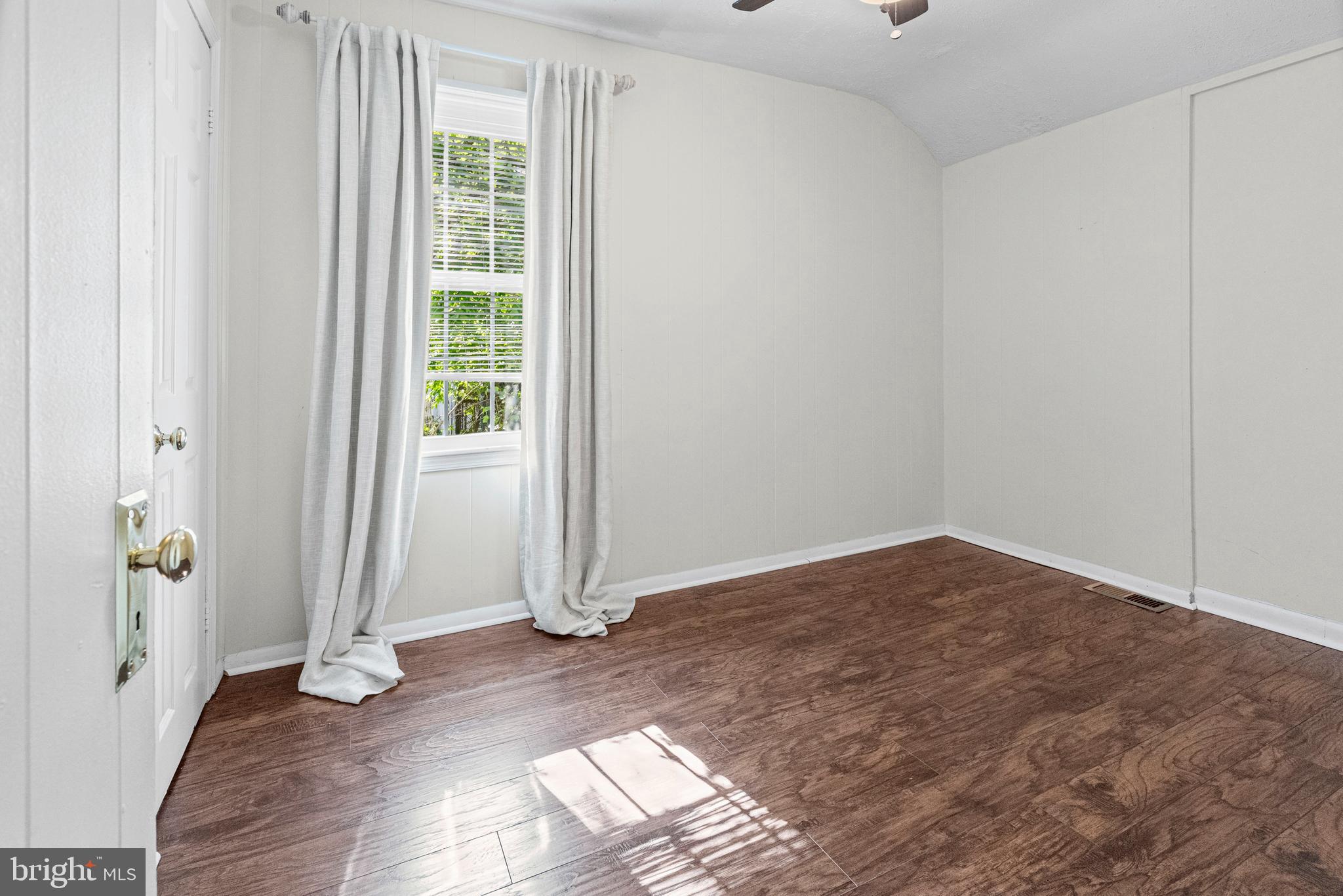 6 Cinder Road Lutherville-Timonium, MD 21093 - Photo 22 of 41 an empty room with wooden floor and windows
