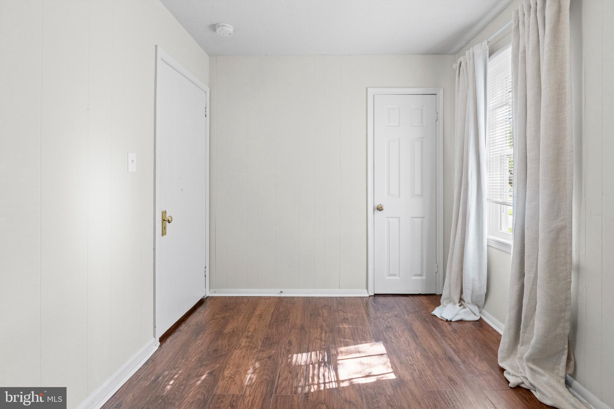 6 Cinder Road Lutherville-Timonium, MD 21093 - Photo 23 of 41 an empty room with wooden floor and a window