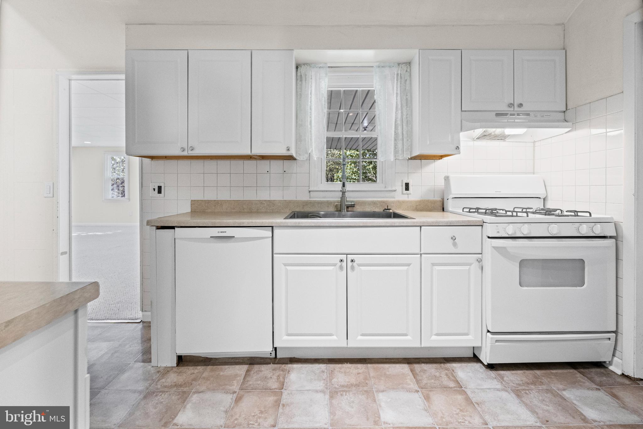 6 Cinder Road Lutherville-Timonium, MD 21093 - Photo 3 of 41 a kitchen with cabinets appliances and a sink