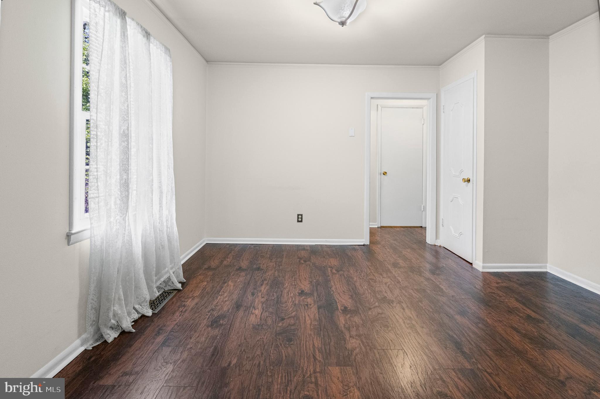 6 Cinder Road Lutherville-Timonium, MD 21093 - Photo 6 of 41 a view of a room with wooden floor and glass doors