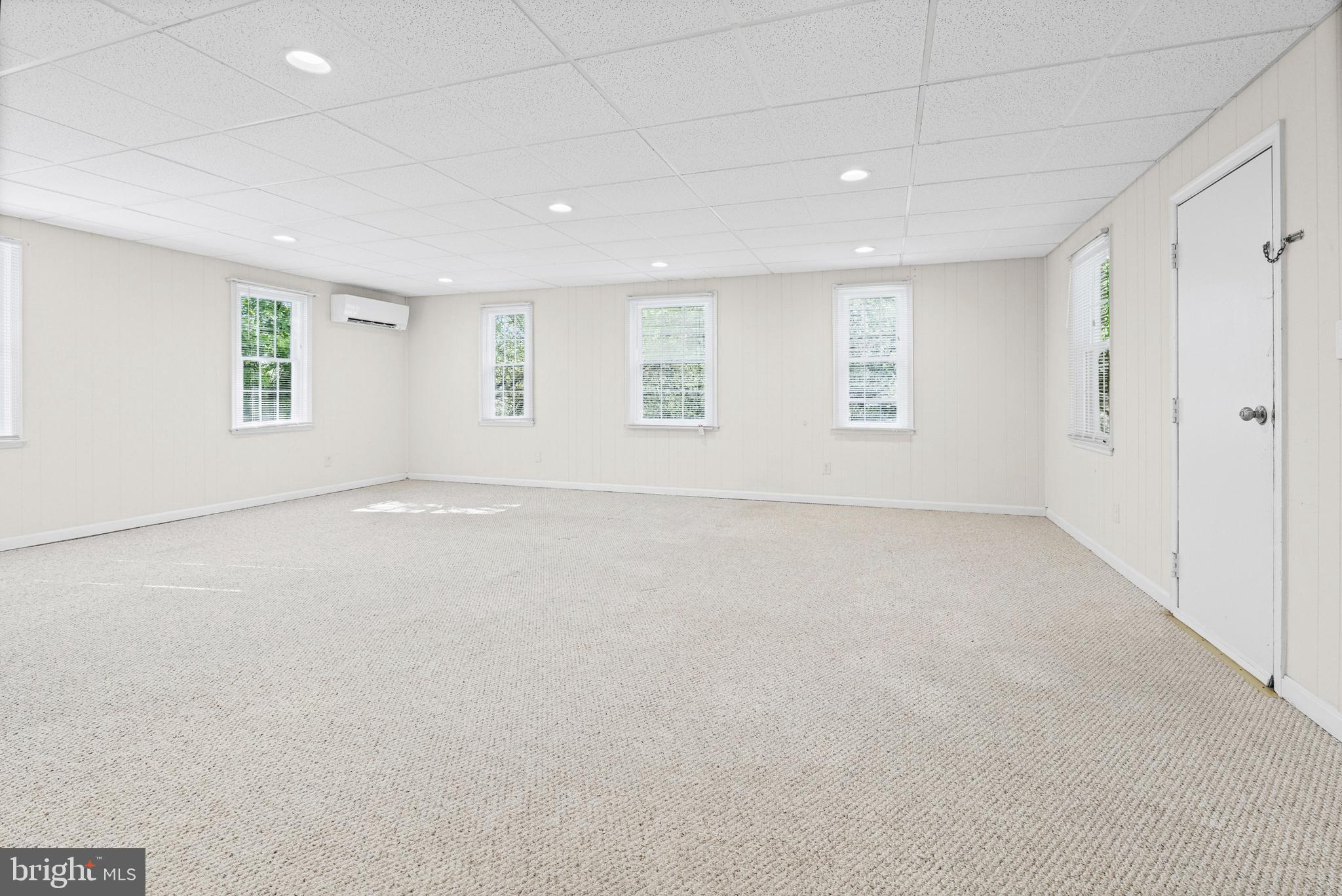 6 Cinder Road Lutherville-Timonium, MD 21093 - Photo 9 of 41 an empty room with a empty space and windows