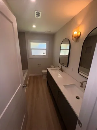 a bathroom with a sink and mirror