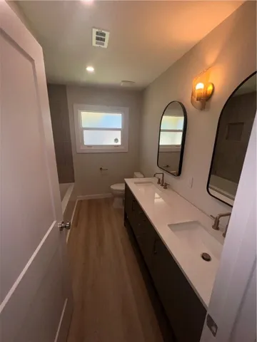a bathroom with a sink and mirror