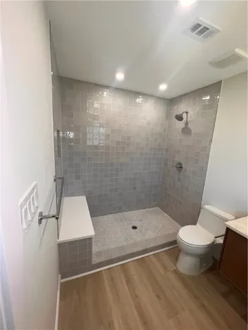 a bathroom with a shower and a toilet