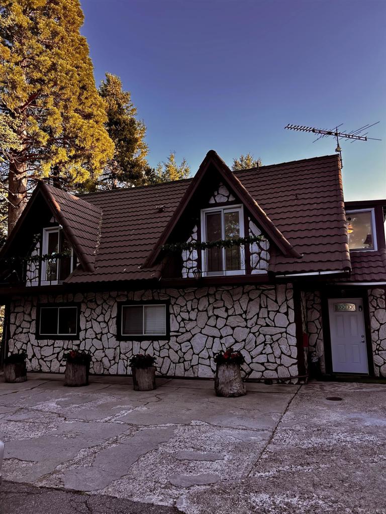 22223 Crestline Road Palomar Mountain, CA 92060 - Photo 76 of 90 a front view of a house with plants
