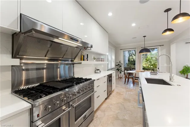 a kitchen with stove cabinets and a stove top oven