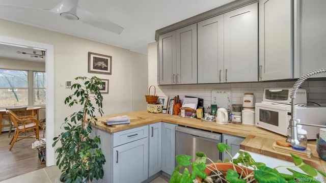 a kitchen with appliances cabinets and a counter top space