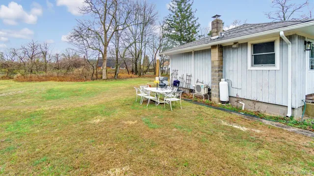 a view of a yard with a large trees