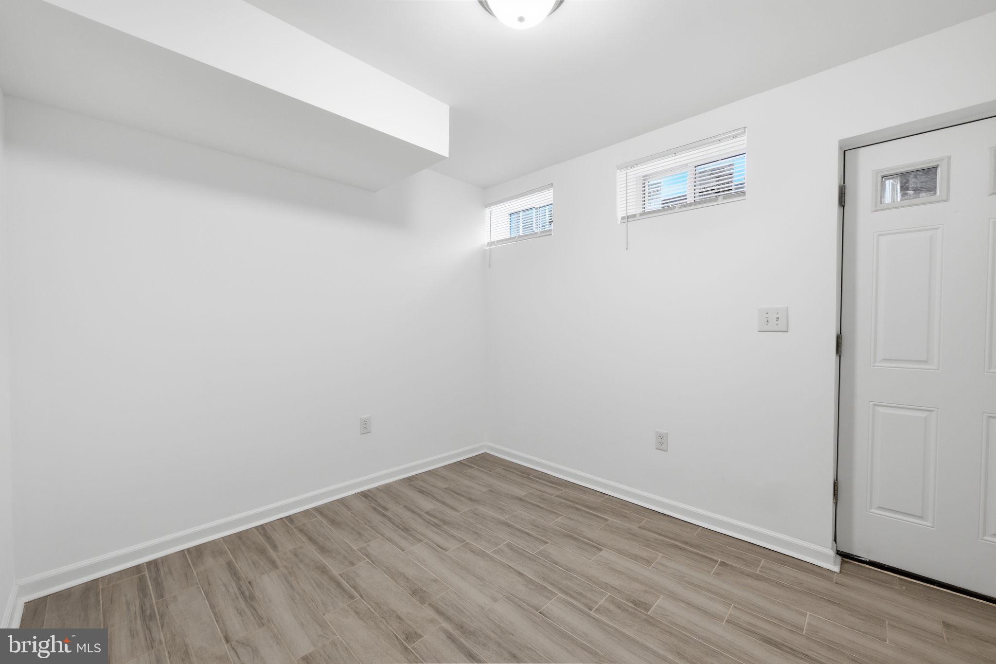 2242 16th Street Northeast Washington, DC 20018 - Photo 18 of 41 wooden floor in an empty room