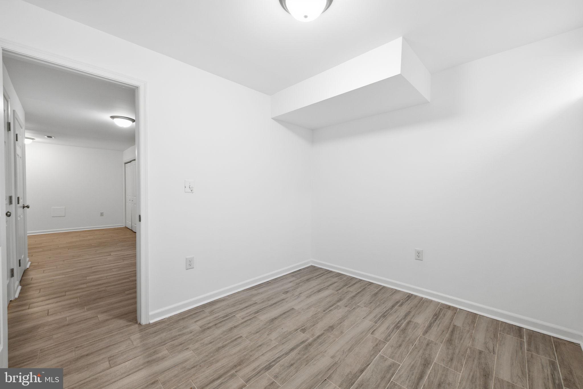 2242 16th Street Northeast Washington, DC 20018 - Photo 19 of 41 a view of a room with wooden floor