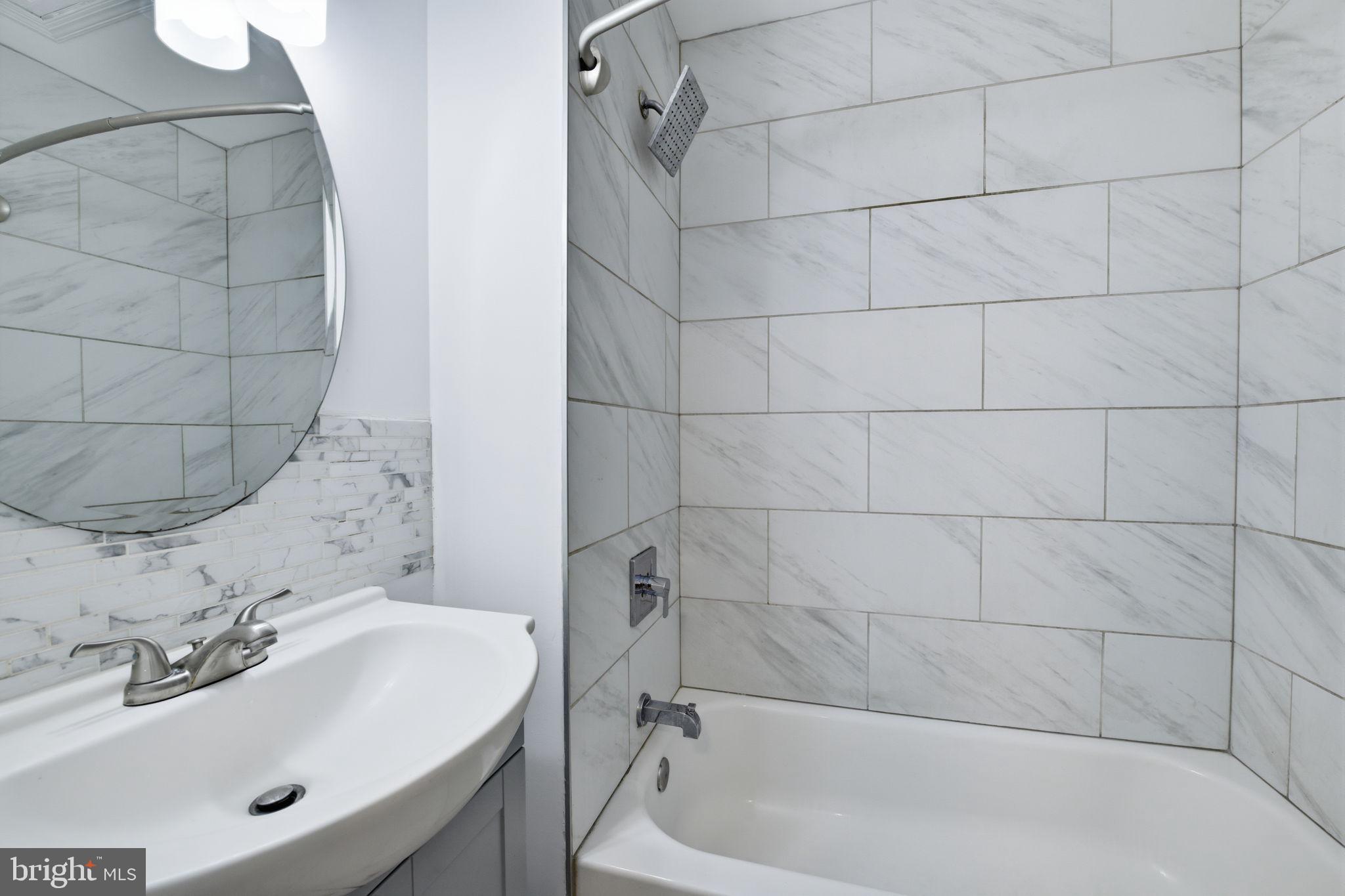 2242 16th Street Northeast Washington, DC 20018 - Photo 22 of 41 a bathroom with a sink and a tub