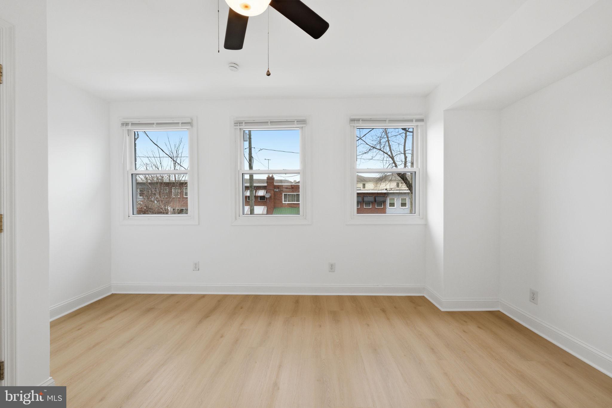 2242 16th Street Northeast Washington, DC 20018 - Photo 30 of 41 wooden floor in an empty room with a window