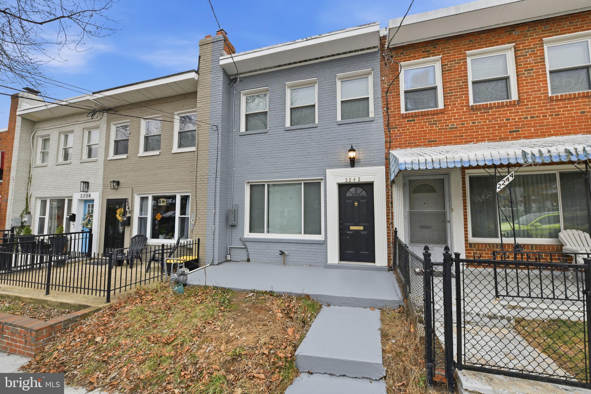 2242 16th Street Northeast Washington, DC 20018 - Photo 4 of 41 a front view of a house with glass windows